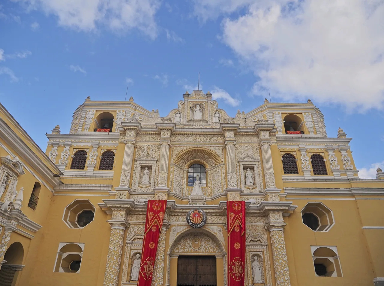 Yellow facade and white ornamentation of La Merced church.