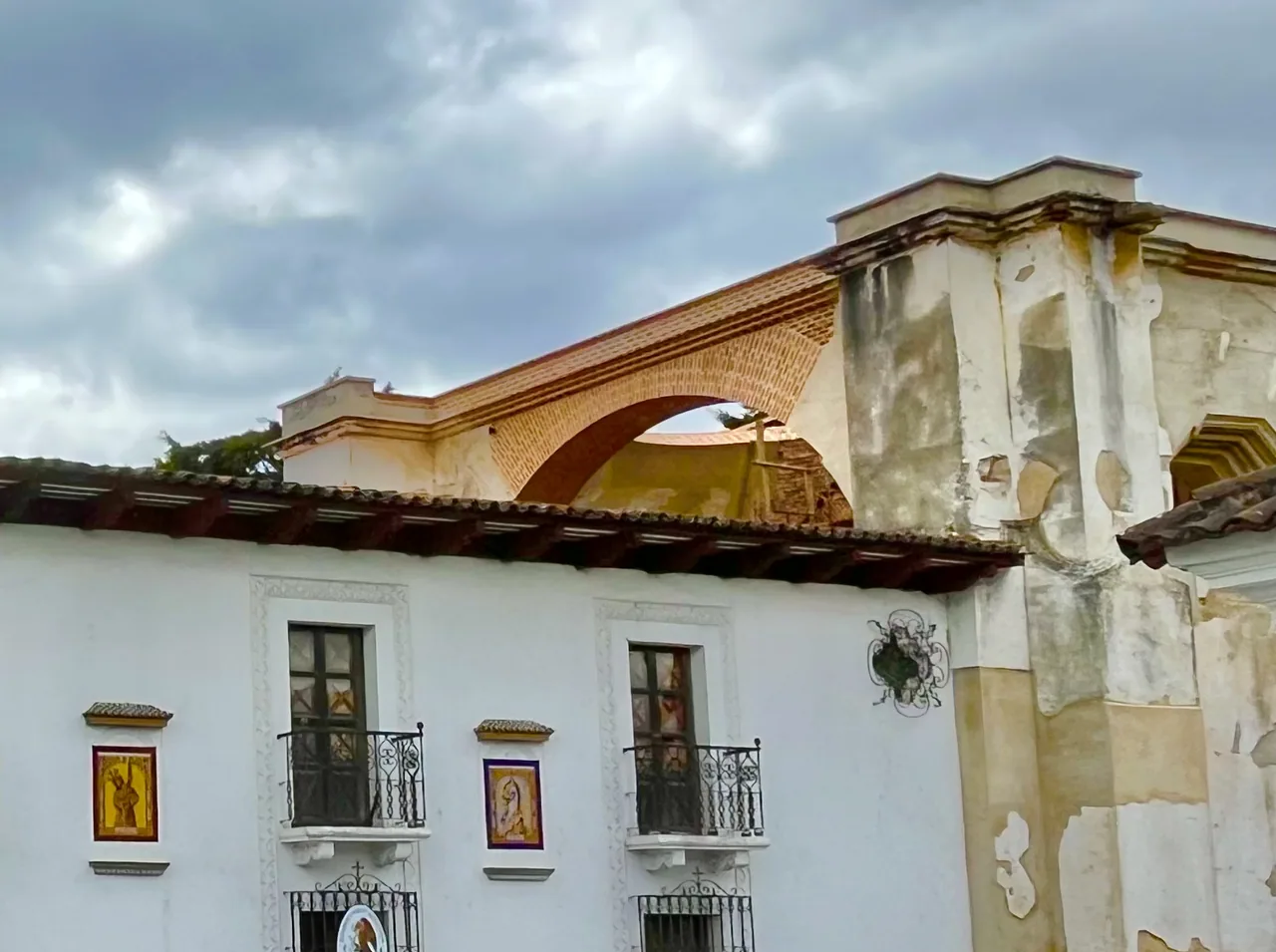 Detail of the white facade and an arch at the Concepción complex.