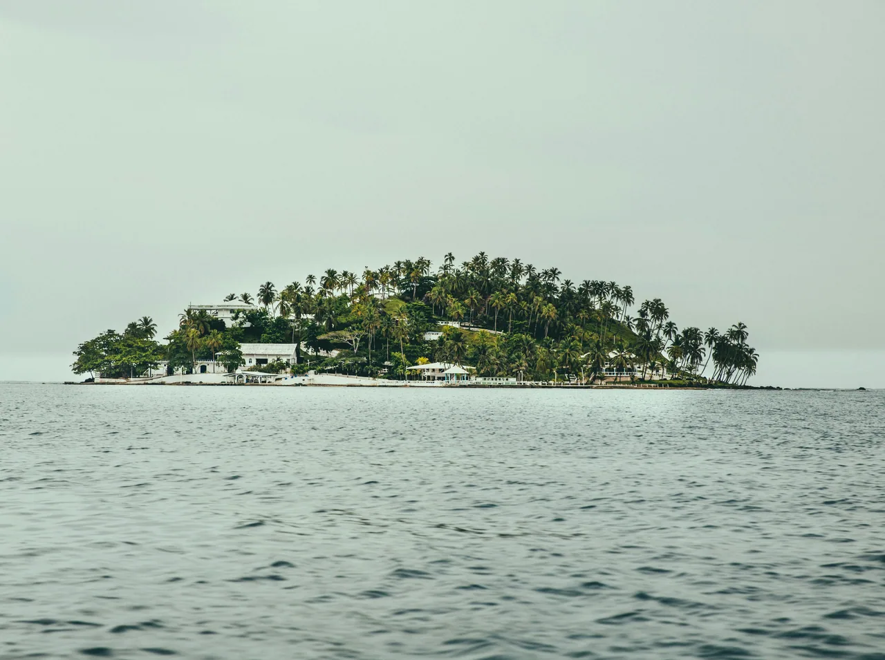 Islet with palms and houses seen from the Isla Grande area.