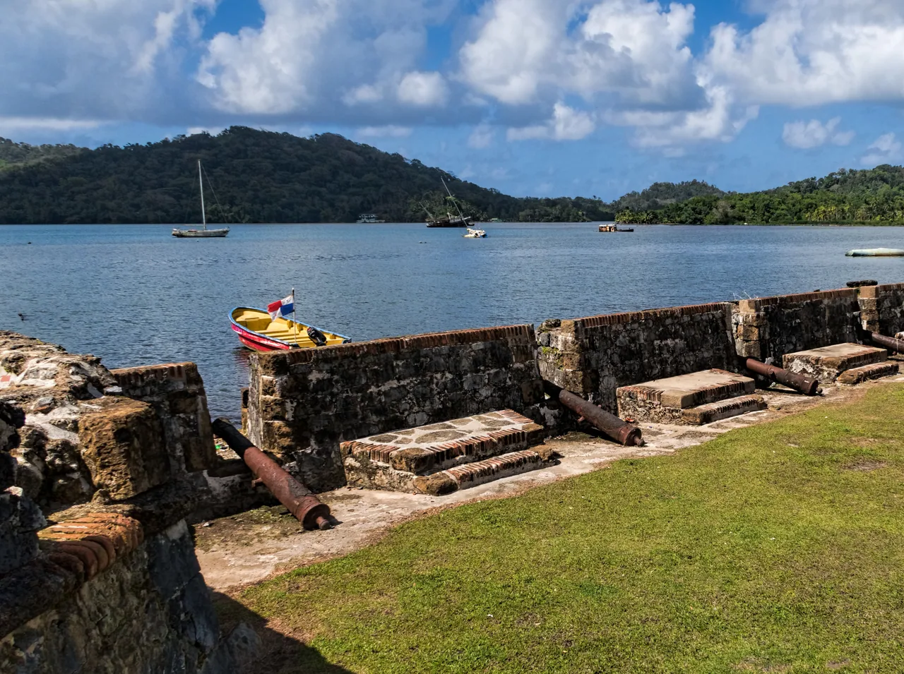 Cannons and a stone wall at Fuerte San Jerónimo overlooking Portobelo Bay.