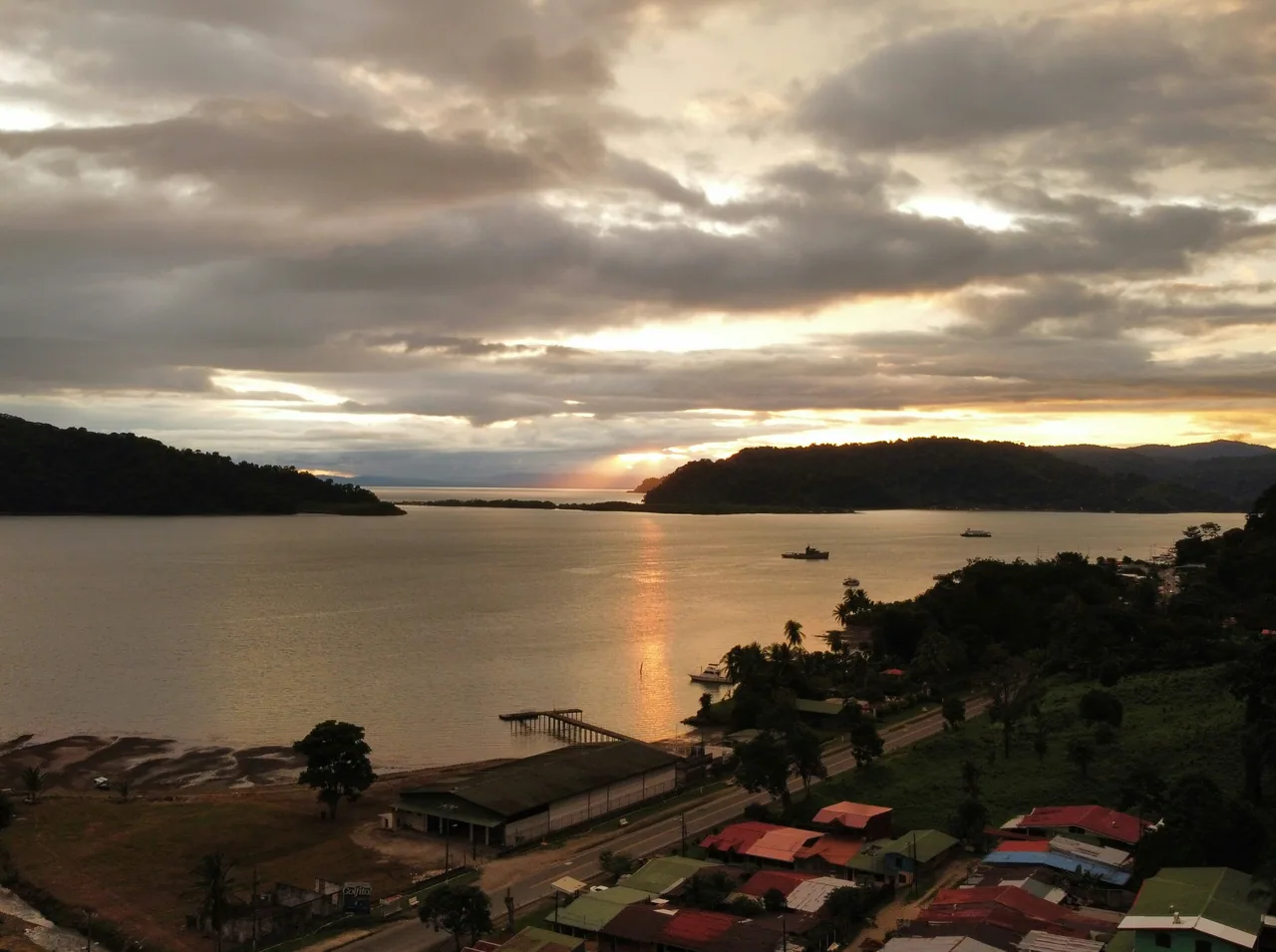 Sunset over Golfito Bay and waterfront houses.
