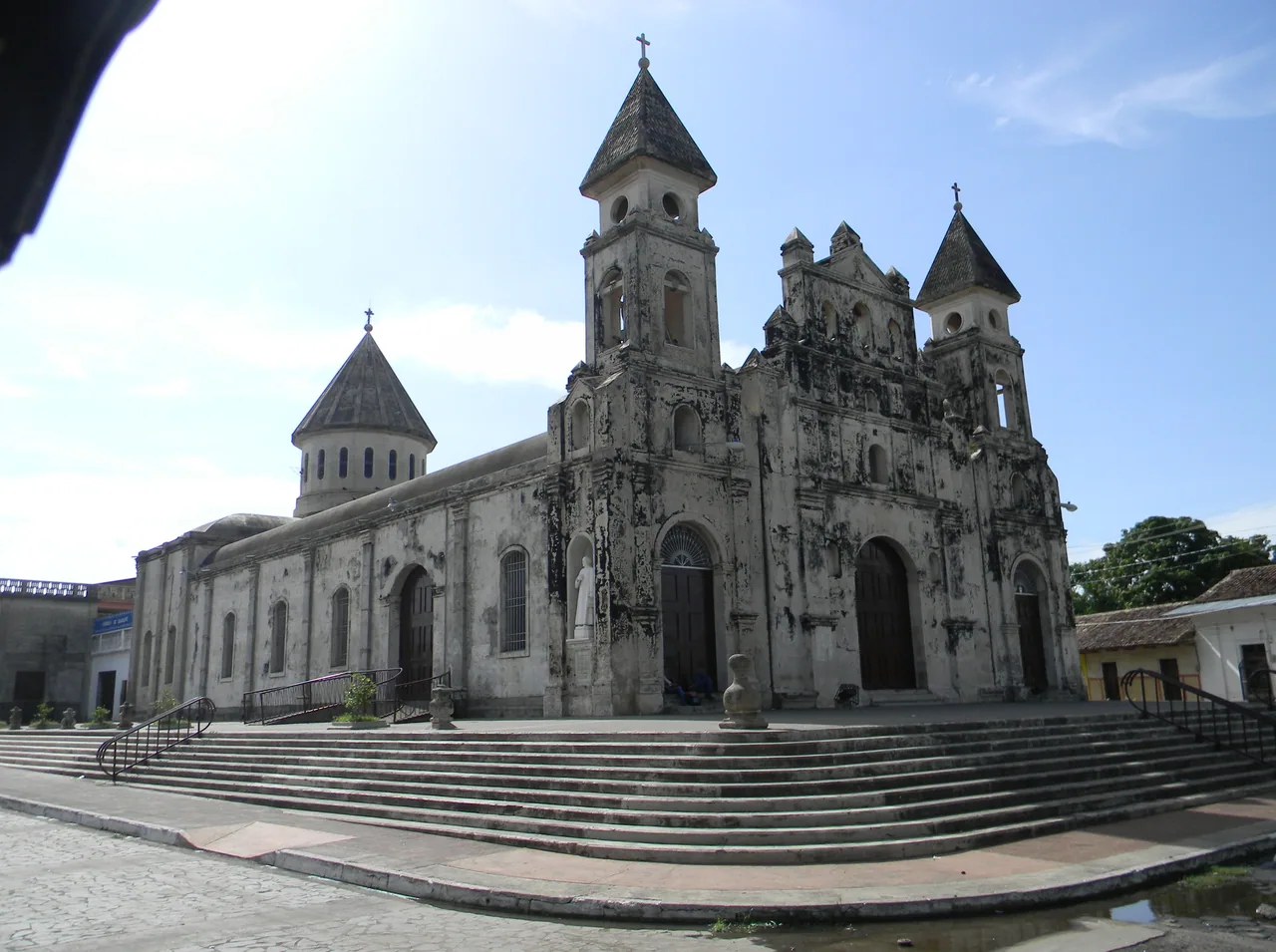 Stone facade, towers and steps of Guadalupe church.