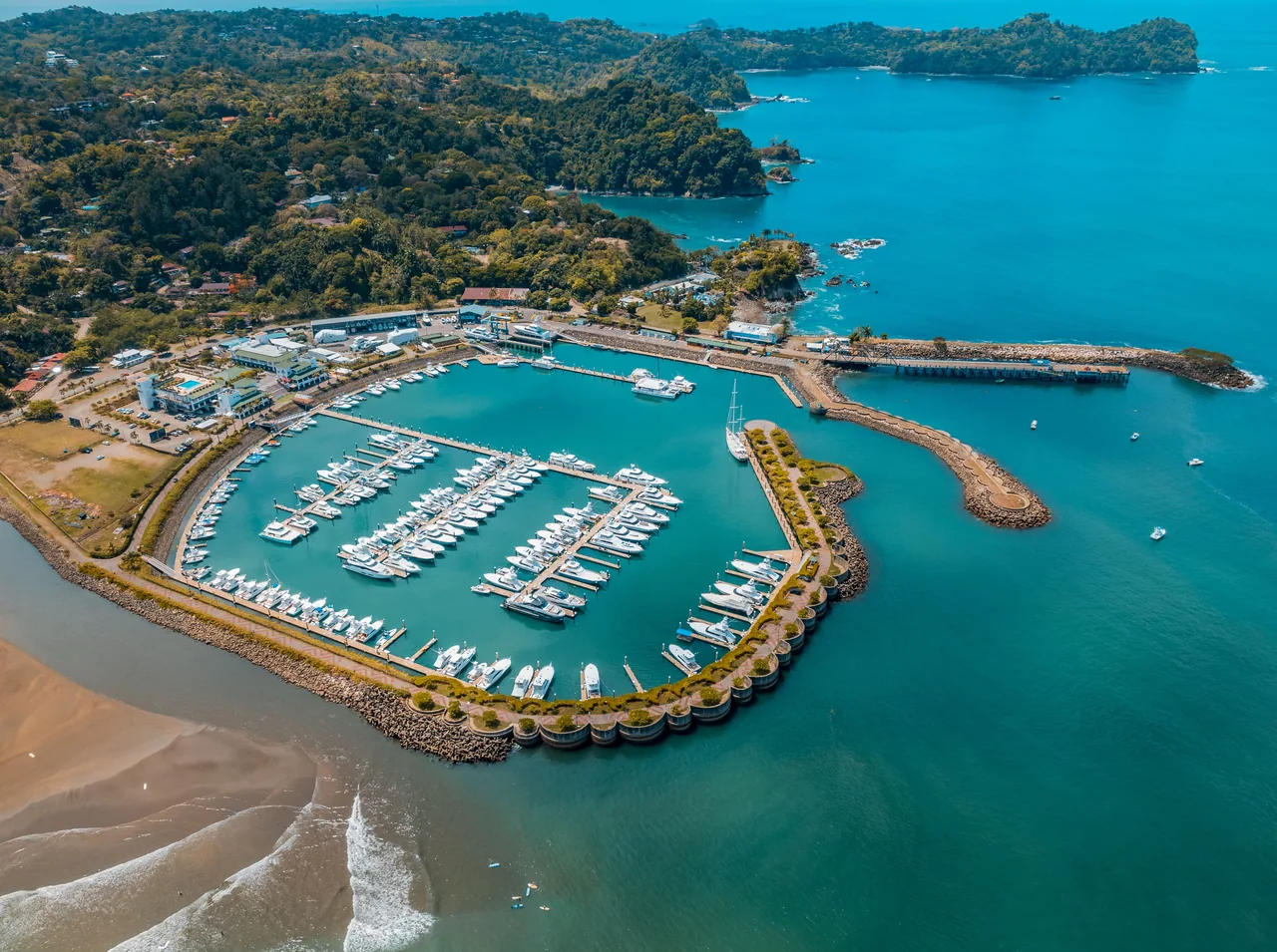 Aerial view of the docks and boats at Marina Pez Vela.
