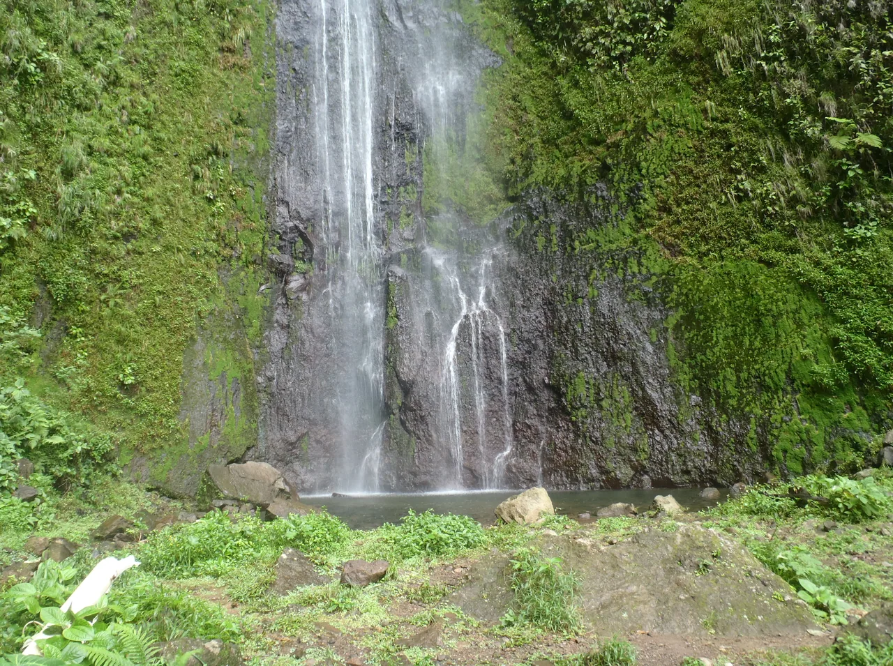 San Ramón waterfall falling down a vegetation-covered rock face on Ometepe.