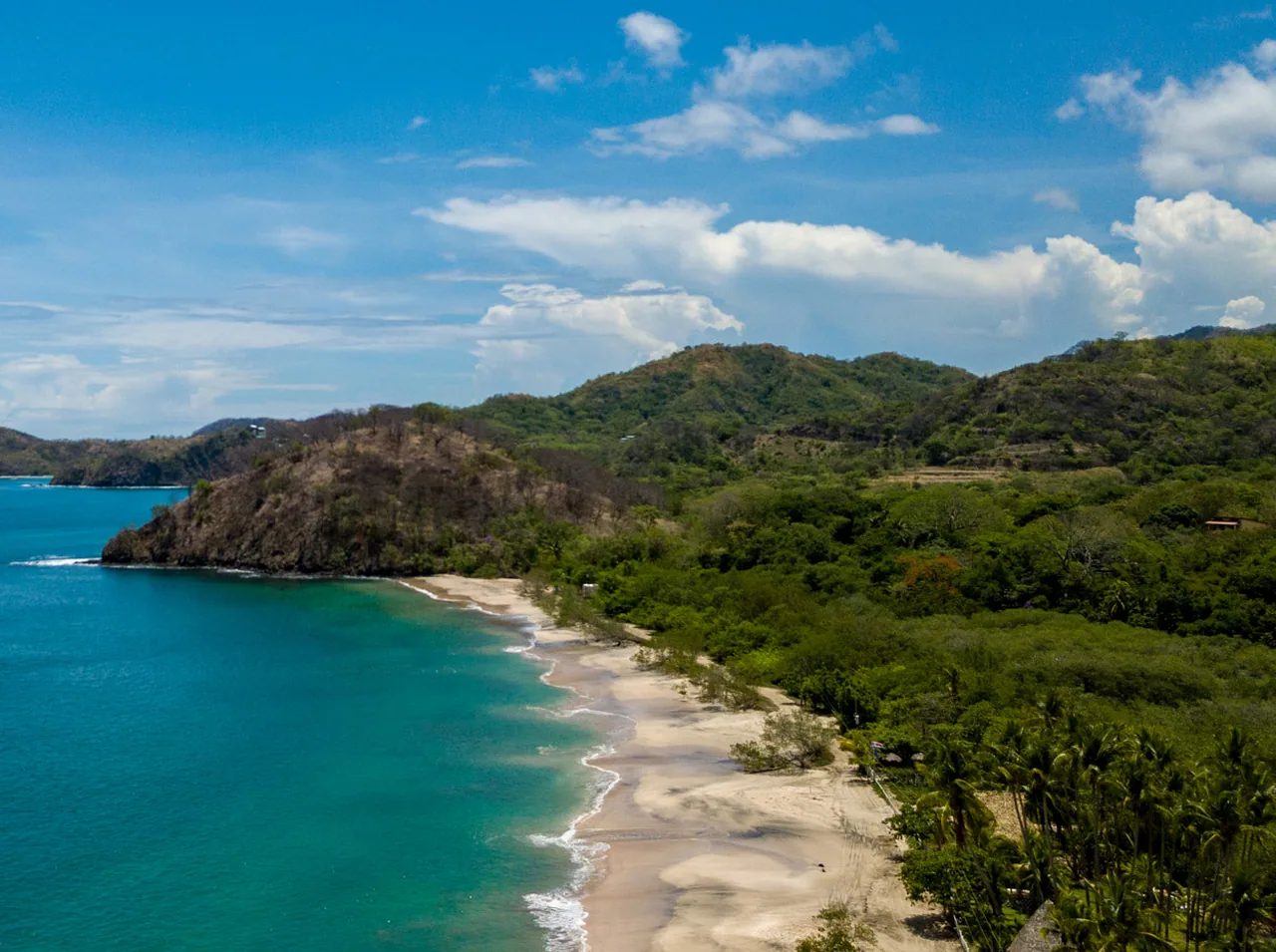 Elevated view of Playa Penca and its turquoise cove.