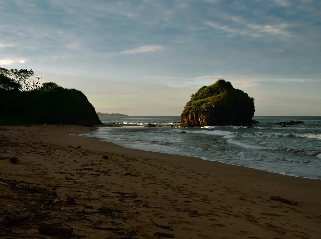 Sand and coastal rock beside Playa Ventanas in Las Baulas.