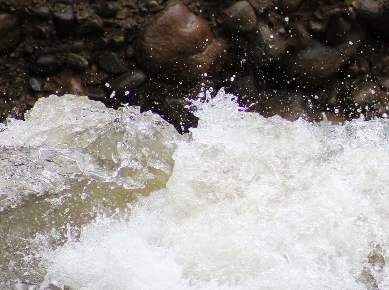 Foamy rapids beside the rocky bank of the Balsa River.